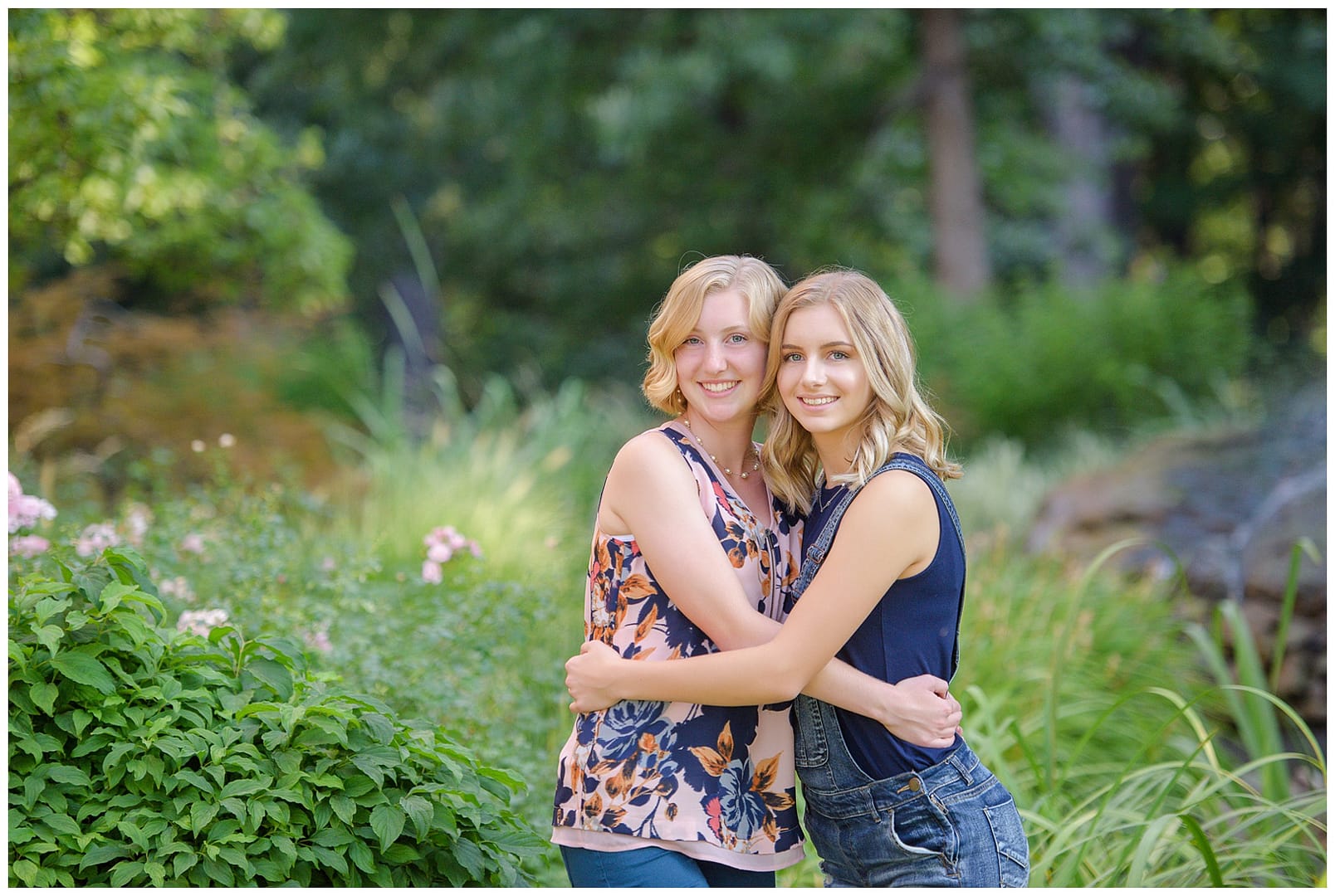Sisters hug during portrait session. Photos by Tiffany Hix Photography.