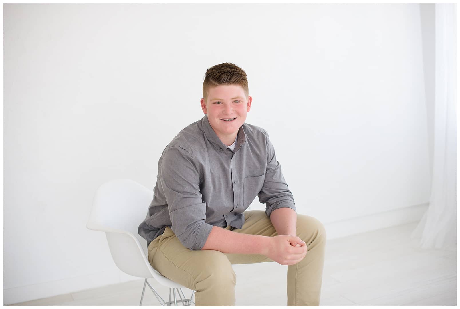 Young man poses for portrait in Boise studio. Photos by Tiffany Hix Photography.