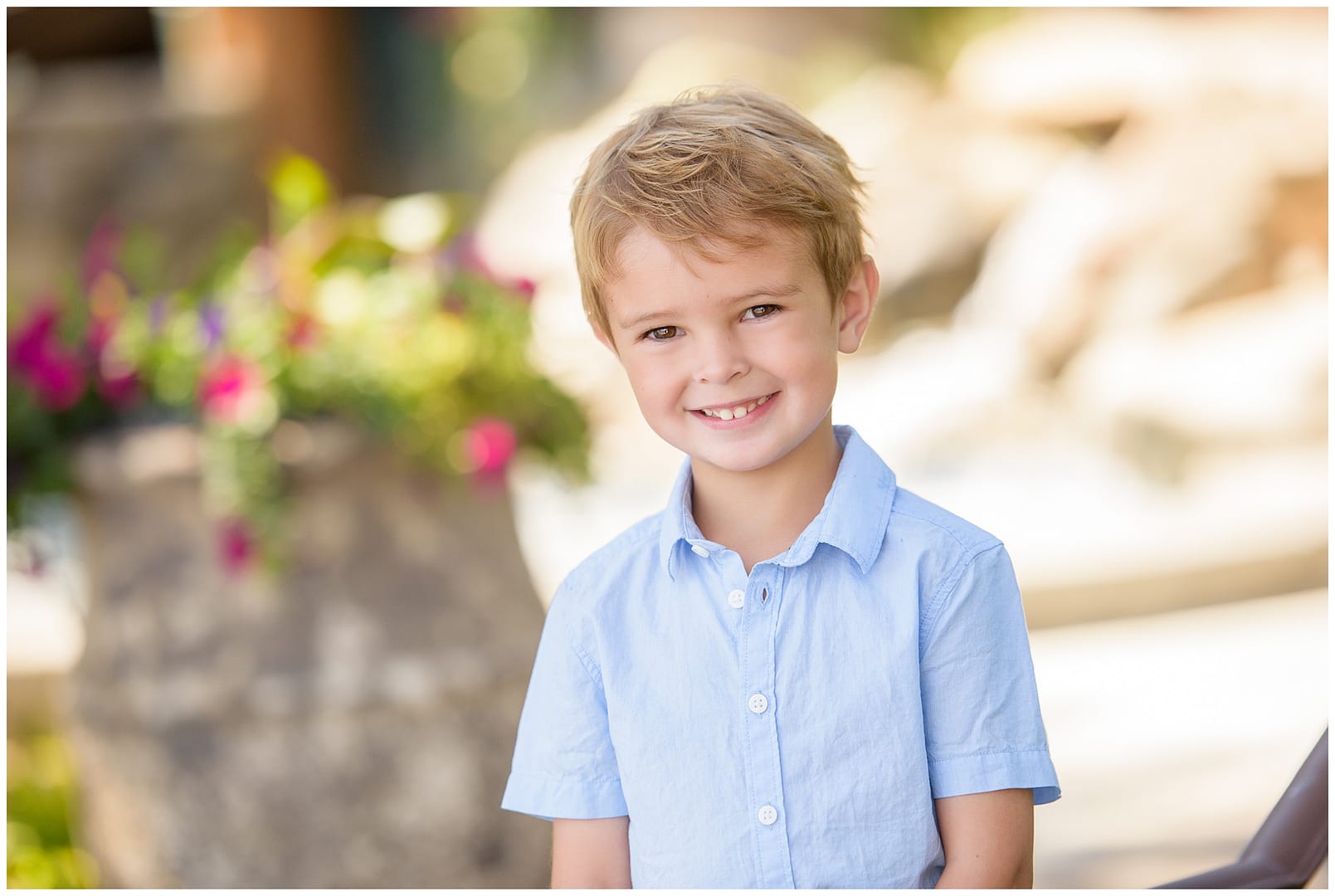 Young boy poses for portrait. Photo by Tiffany Hix Photography.