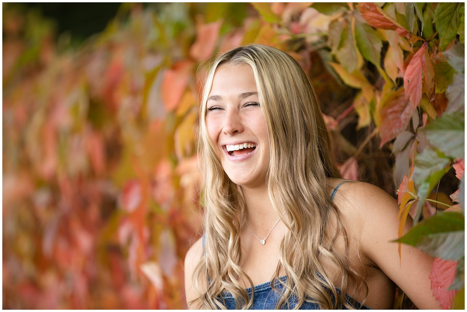 High school senior laughing. Photo by Tiffany Hix Photography.