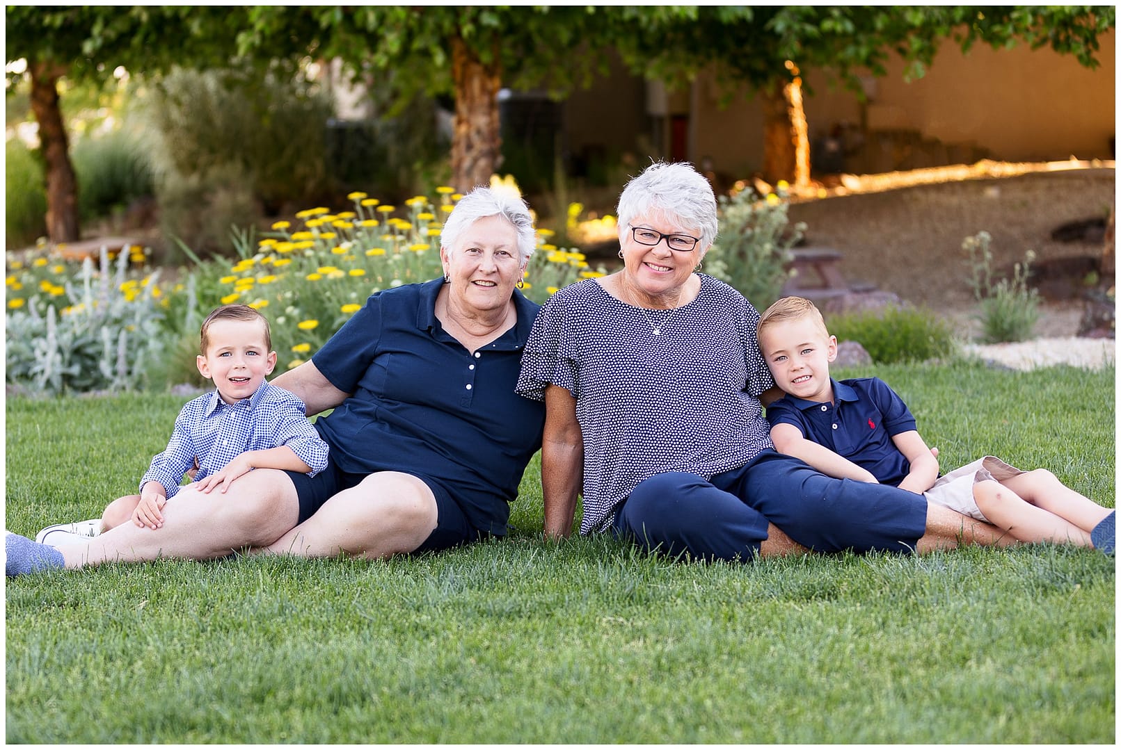 Grandparents pose on grass during Boise grandparent session. Photo by Tiffany Hix Photography.