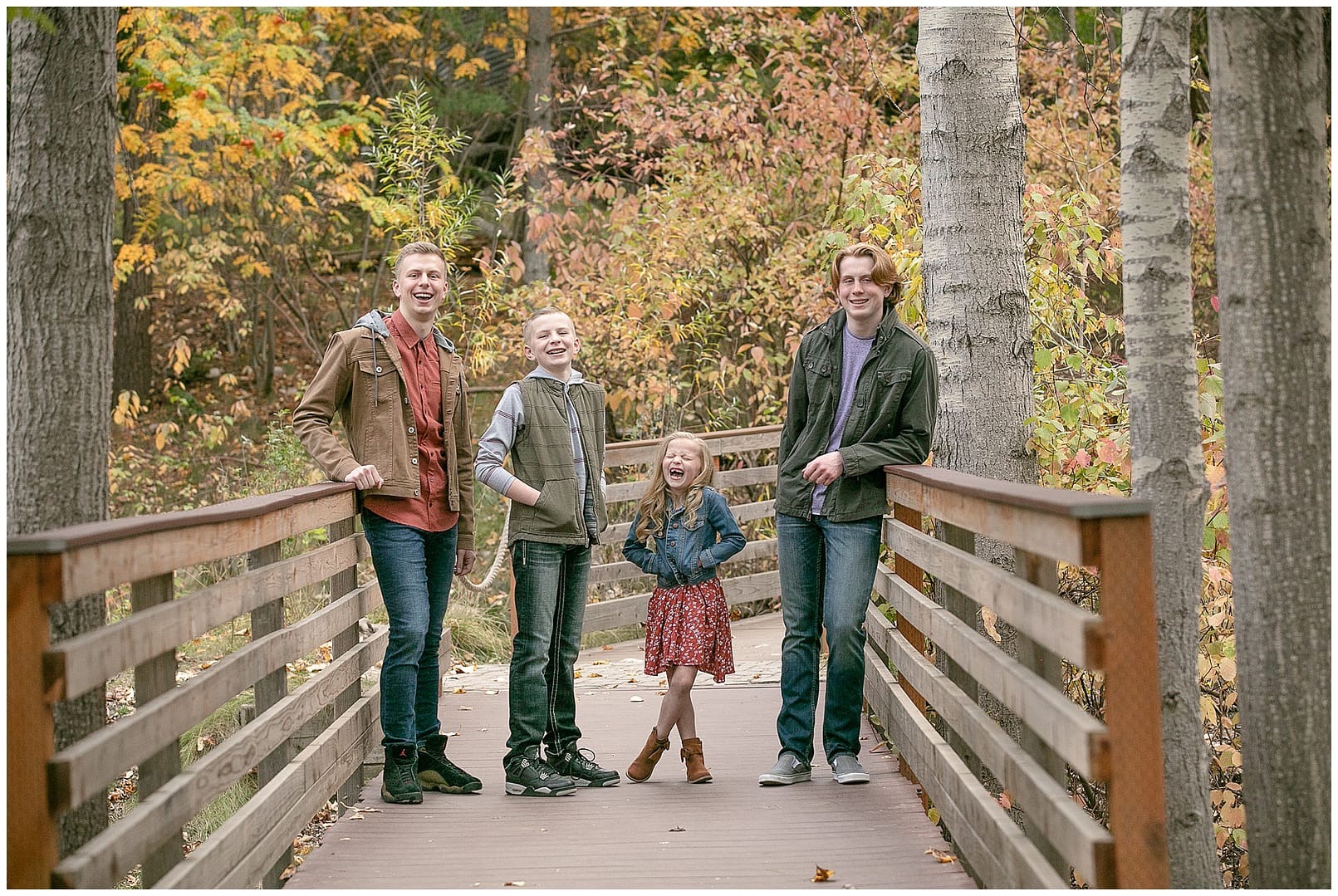 Group of siblings engage in laughter. Photo by Tiffany Hix Photography.