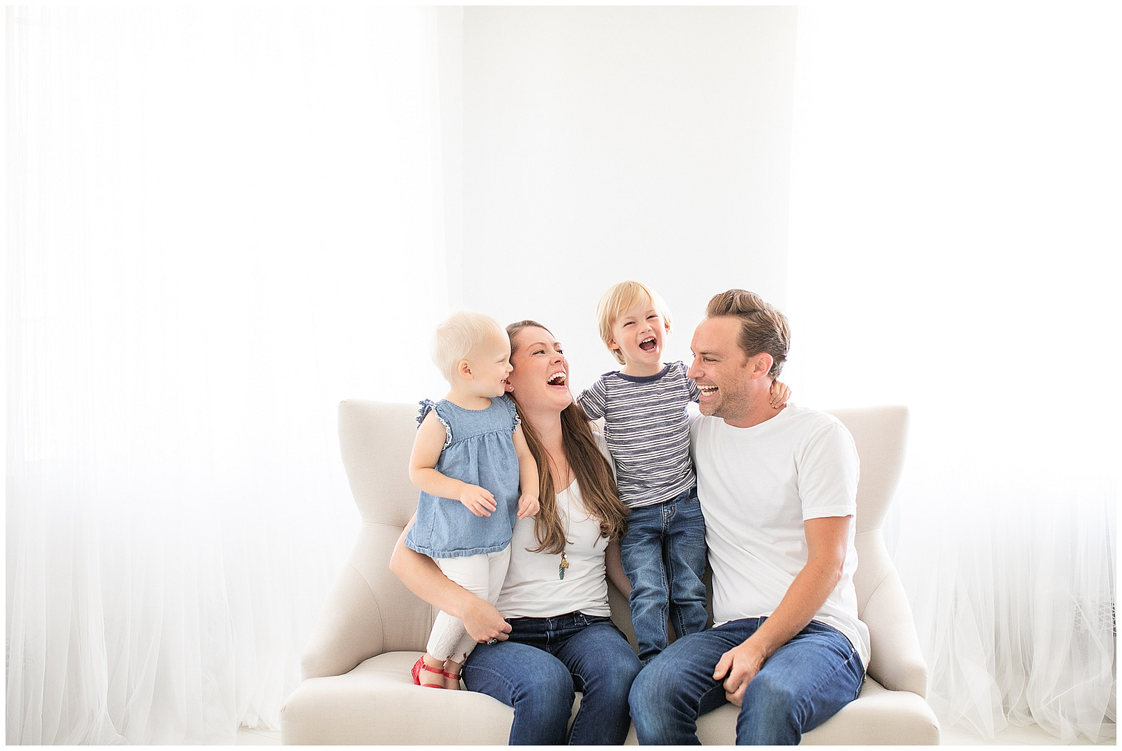 Family laughs together in Boise studio session. Photos by Tiffany Hix Photography.