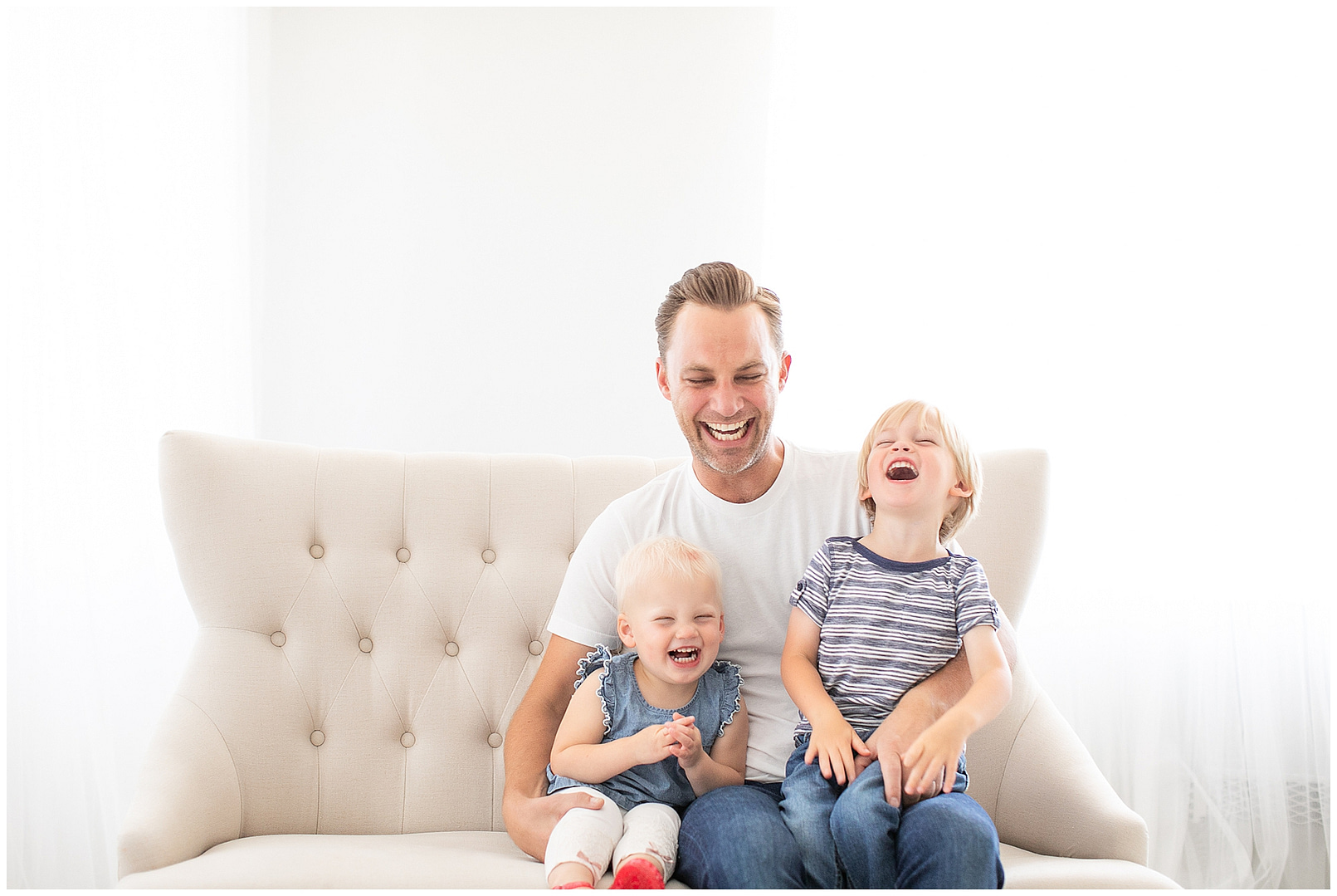 Dad laughs with children in Boise studio session. Photos by Tiffany Hix Photography.