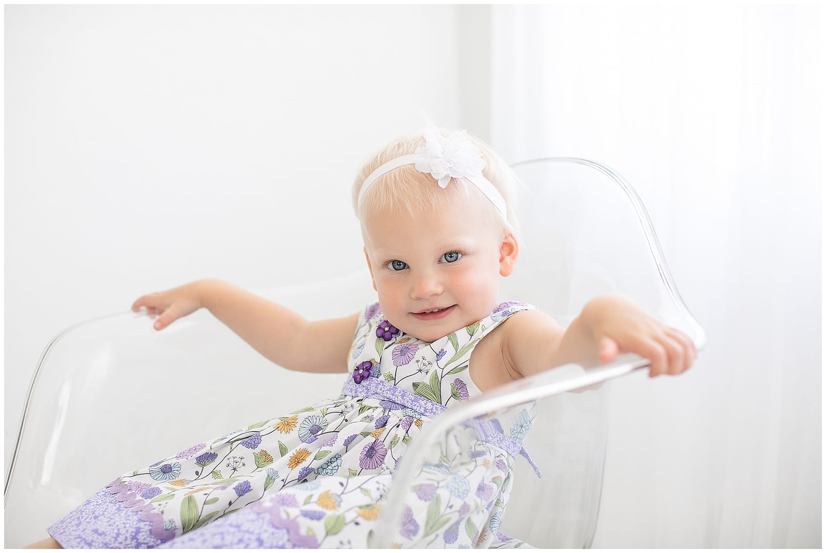 Toddler girl poses for her photograph in studio. Photos by Tiffany Hix Photography.