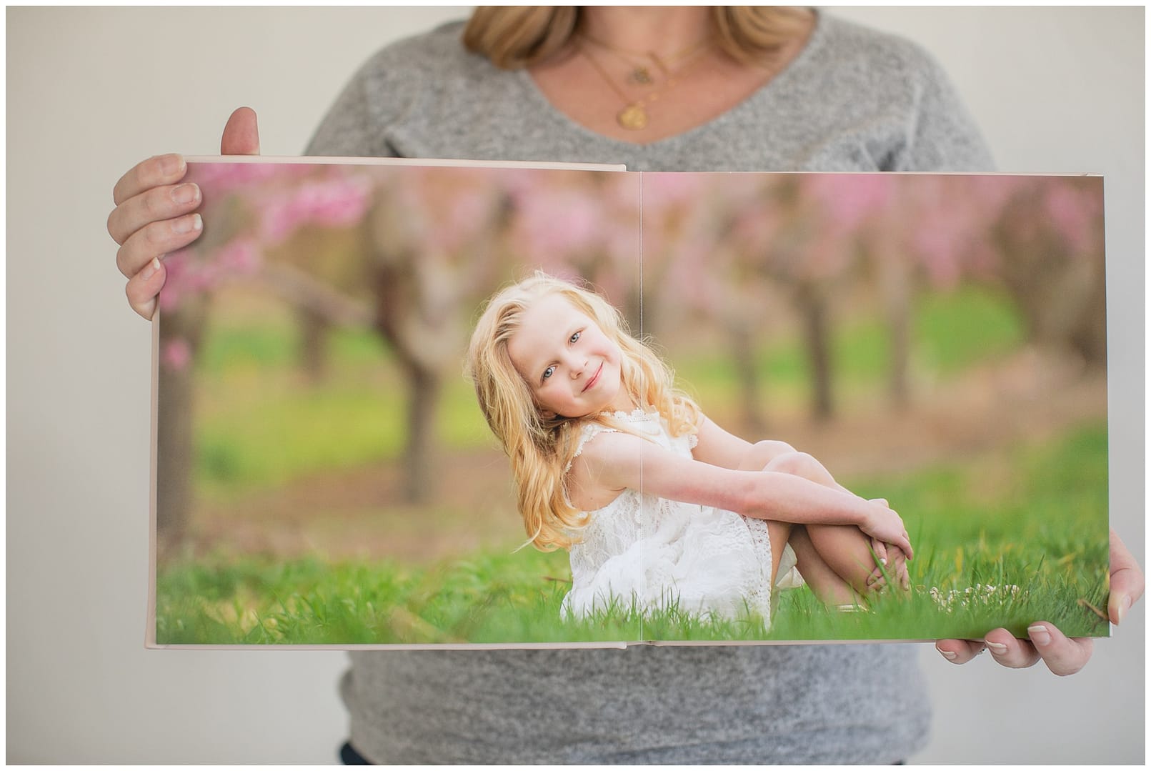 Photo of little girl in album. Photos by Tiffany Hix Photography.