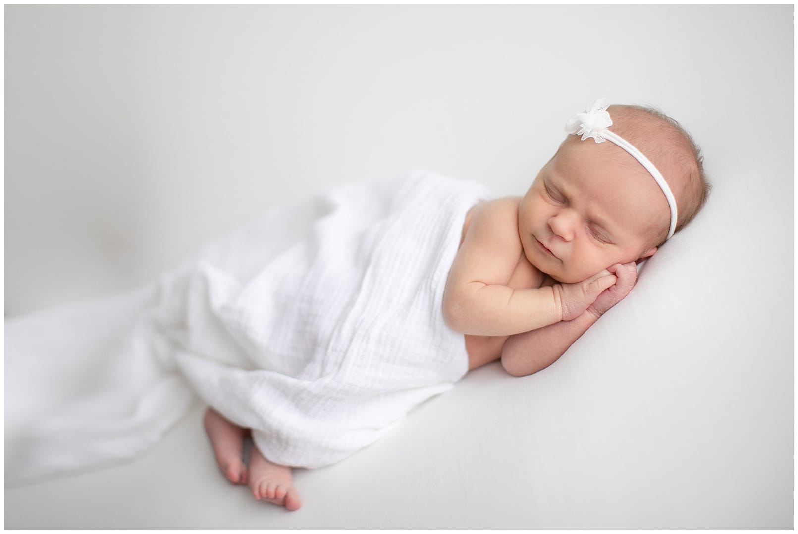 Boise newborn photographer. Baby led posing in studio. Photo by Tiffany Hix Photography.