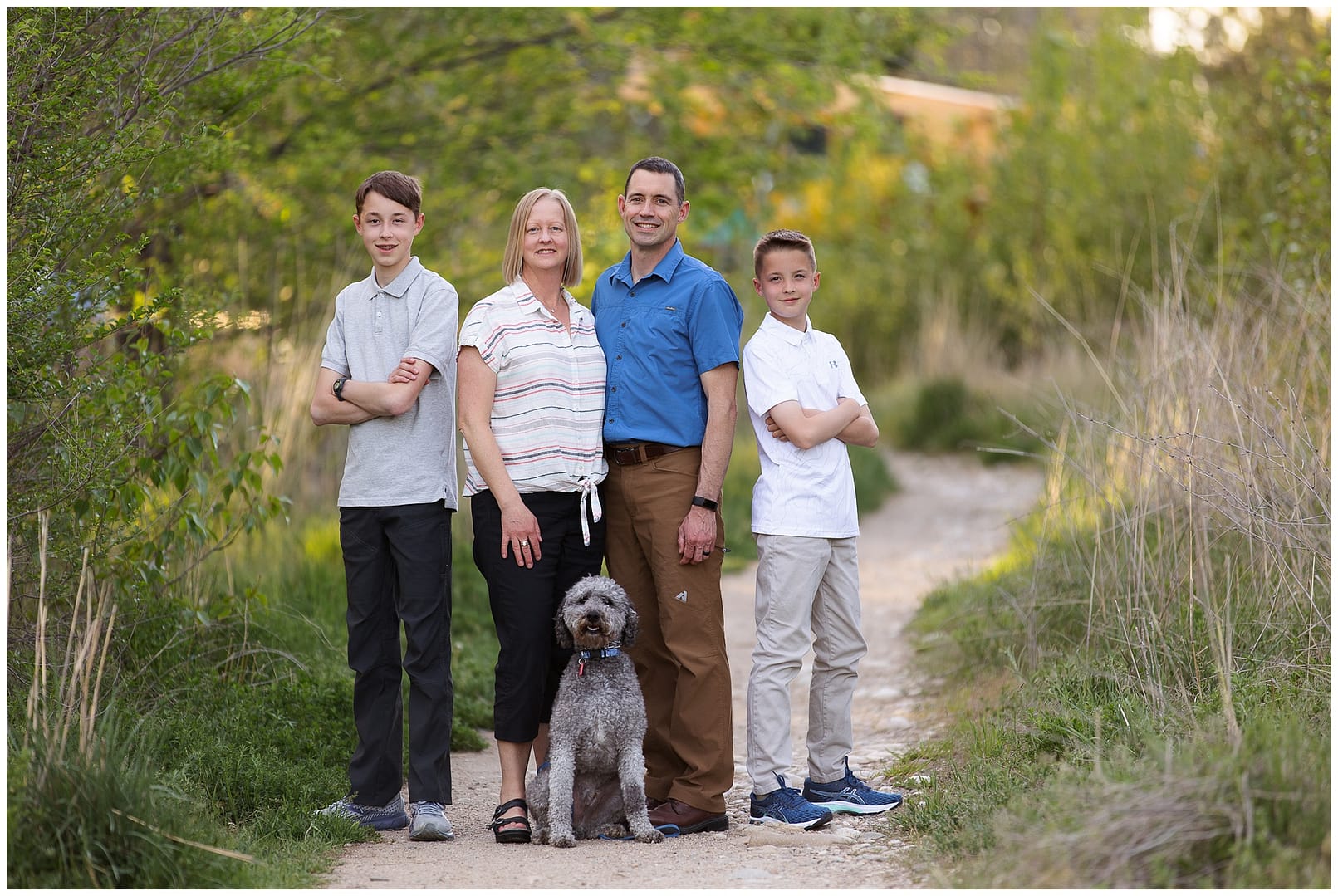 Family of four poses with dog. Photos by Tiffany Hix Photography.