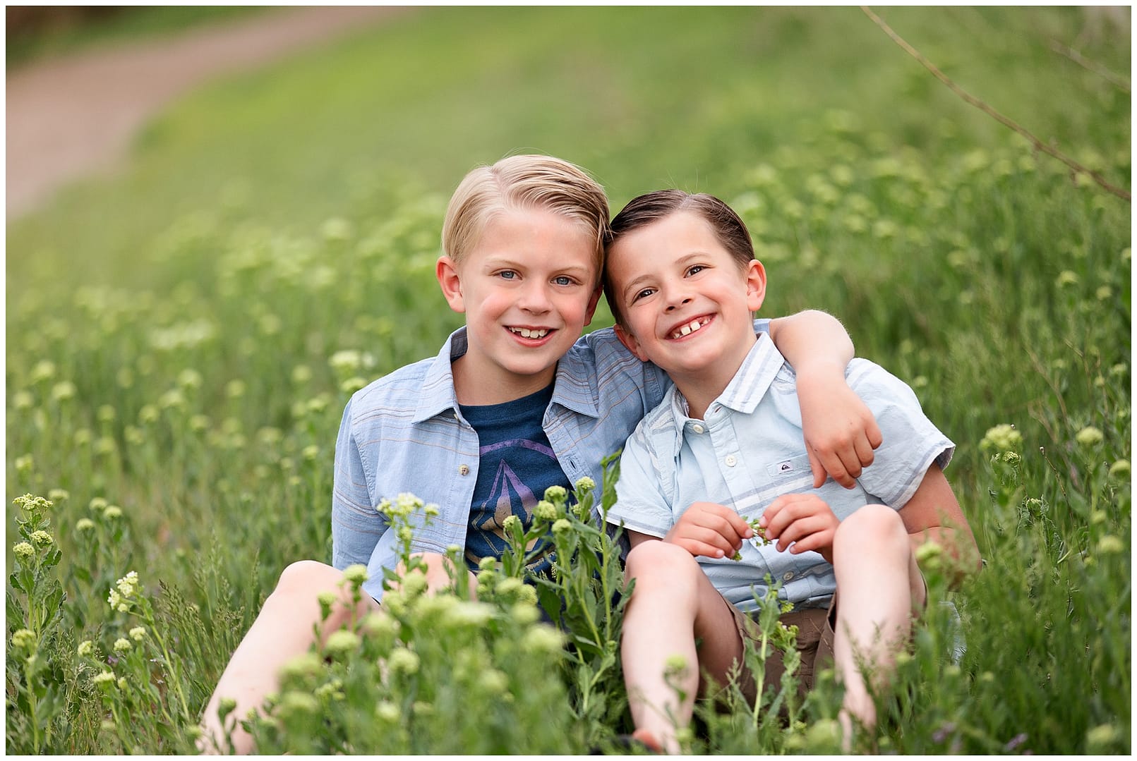 Brother pose for a portrait. Photo by Tiffany Hix Photography.