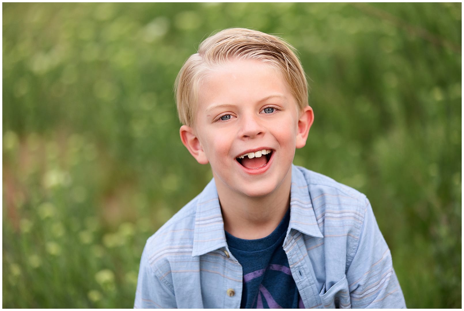 Boy smiles for camera in Meridian, ID. Photo by Tiffany Hix Photography.