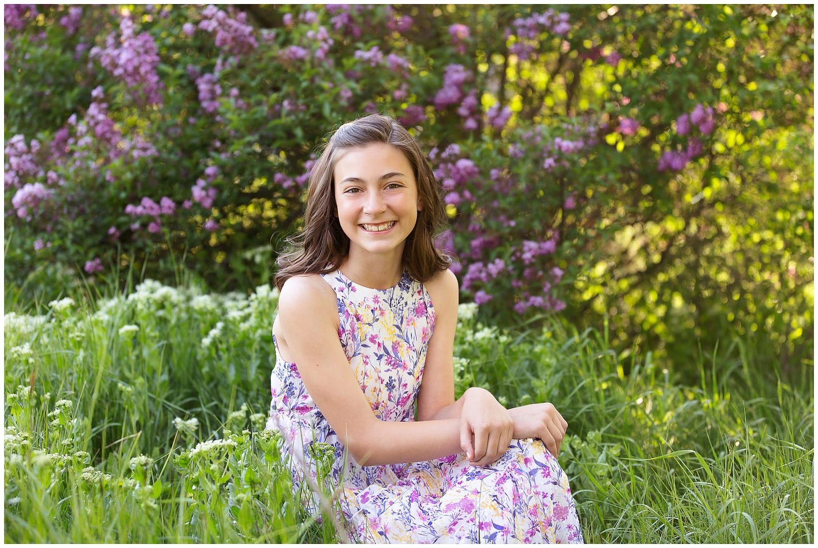 Young girl sits among the lilacs in Boise. Photos by Tiffany Hix Photography.