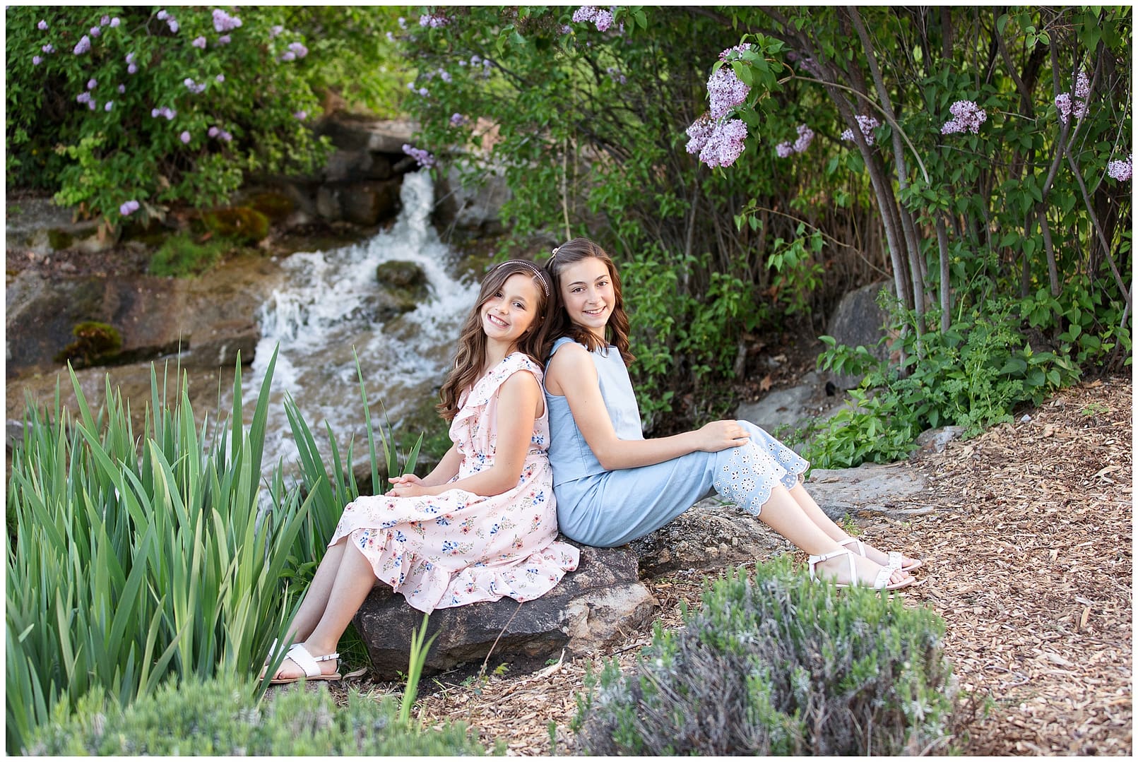 Sisters posing back to back. Photos by Tiffany Hix Photography.