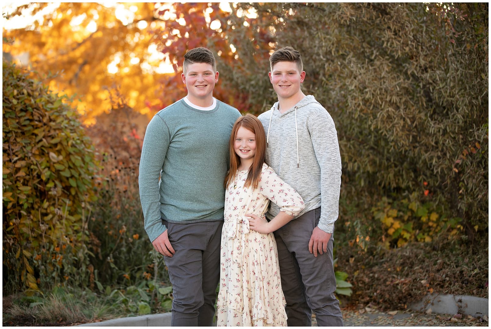 Boise siblings in fall foliage. Photo by Tiffany Hix Photography.