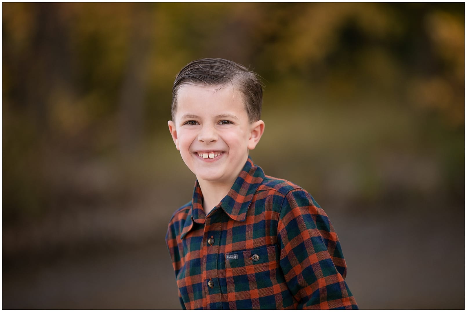 Boise child smiles for camera. Photos by Tiffany Hix Photography.