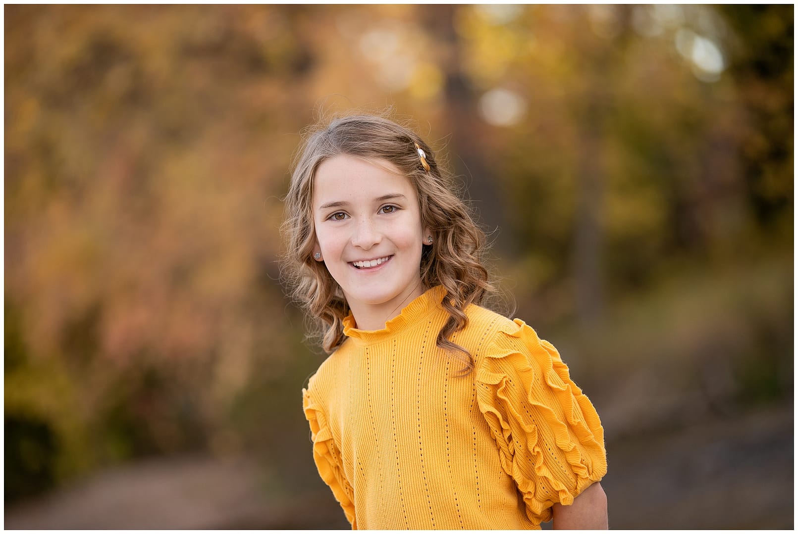 Young girl in yellow sweater. Photos by Tiffany Hix Photography.