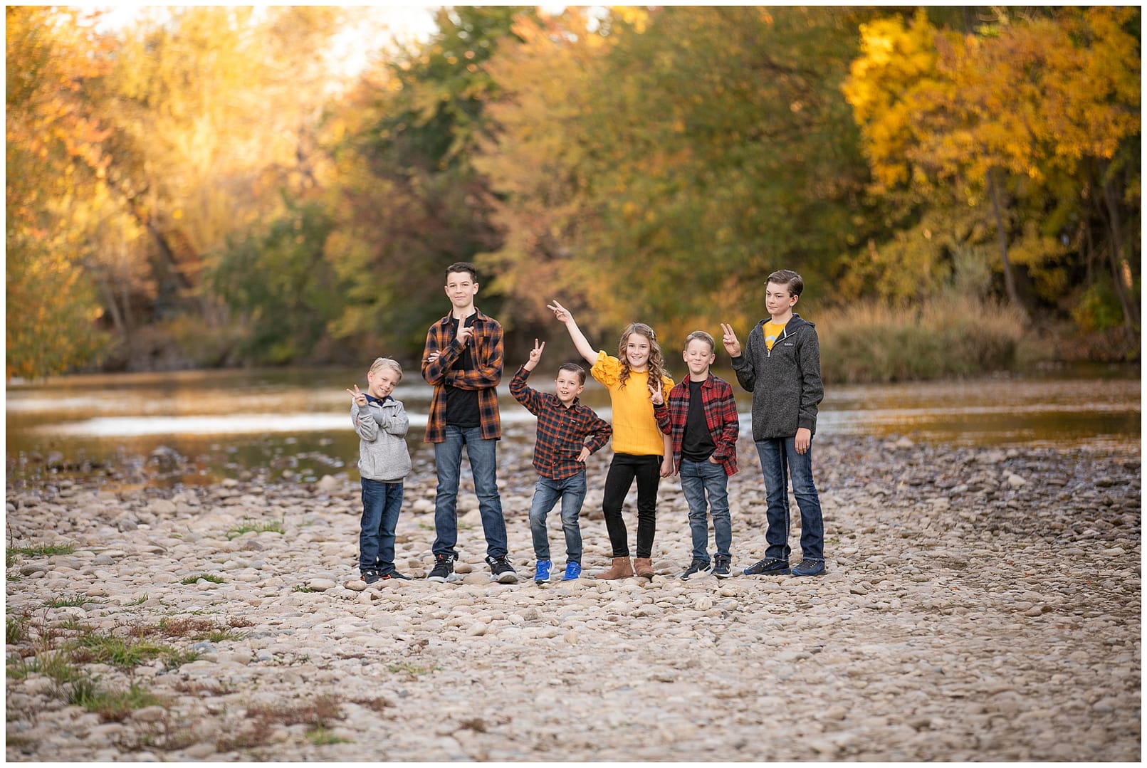 Boise kids acting silly in front of river. Photos by Tiffany Hix Photography.