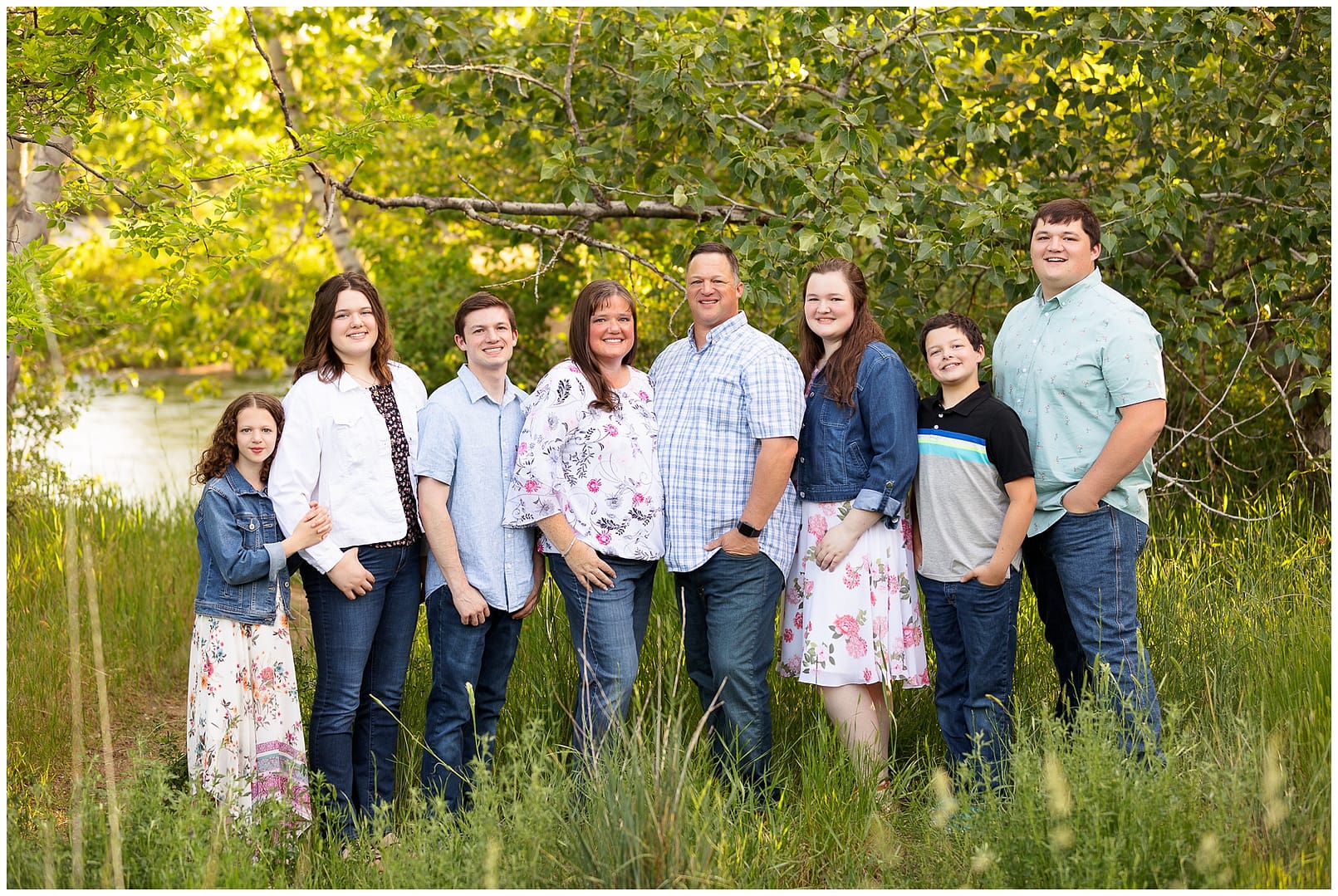 Large family portrait on the bank of the Boise River. Photo by Tiffany Hix Photography.