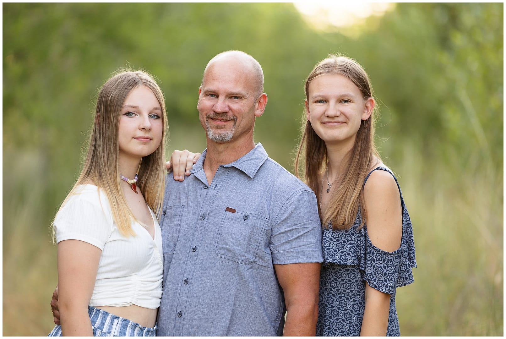 Dad and his two daughters. Photo by Tiffany Hix Photography.