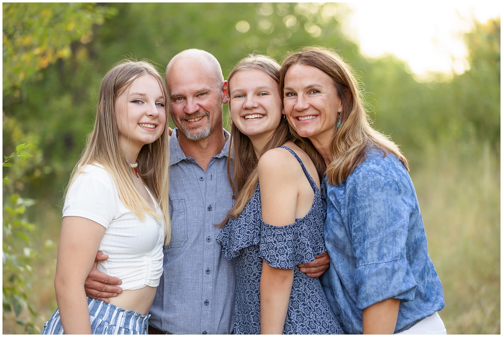 Family squeezes in for a close portrait. Photo by Tiffany Hix Photography.