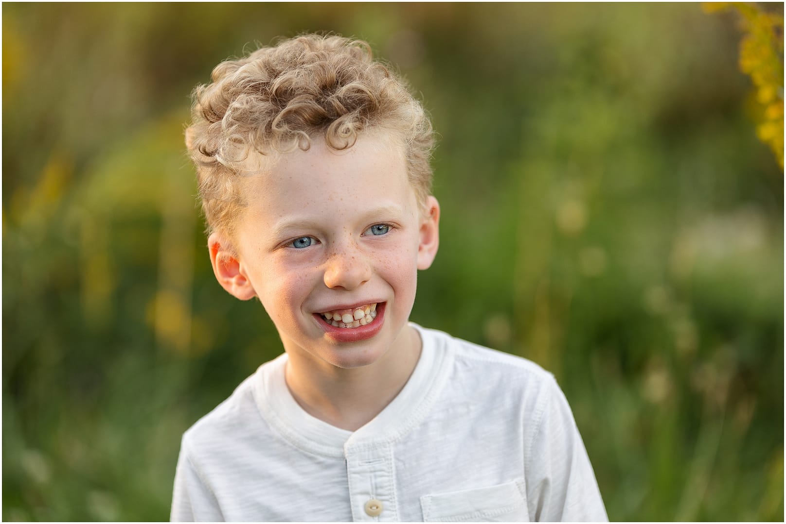 Candid of curly haired little boy. Photo by Tiffany Hix Photography.