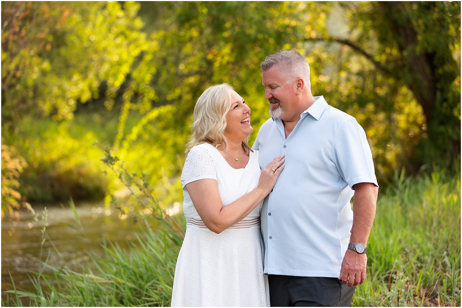 Mom & Dad smile at one another during Boise family photo session. Photo by Tiffany Hix Photography.