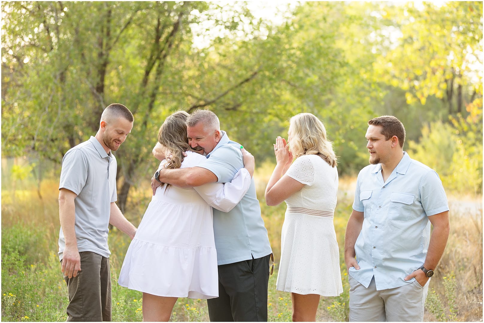 Dad embraces daughter after finding out he is going to be a grandpa. Photo by Tiffany Hix Photography.