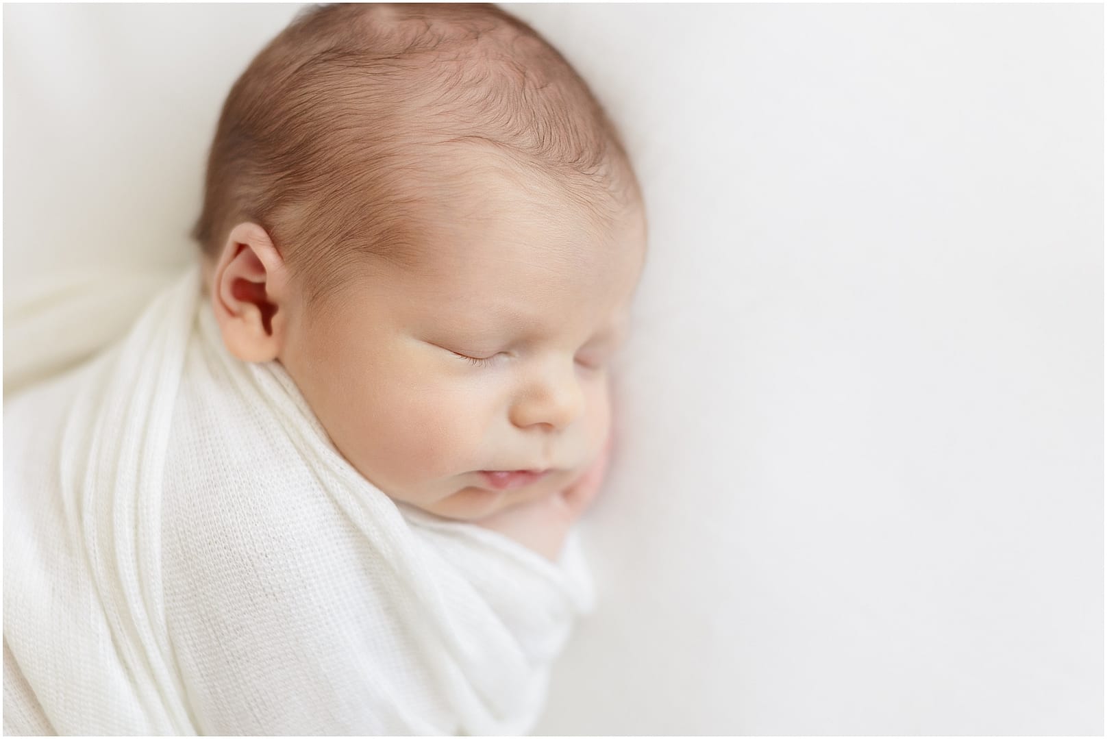 Detail shot of eyelashes on newborn baby boy. Photo by Tiffany Hix Photography.