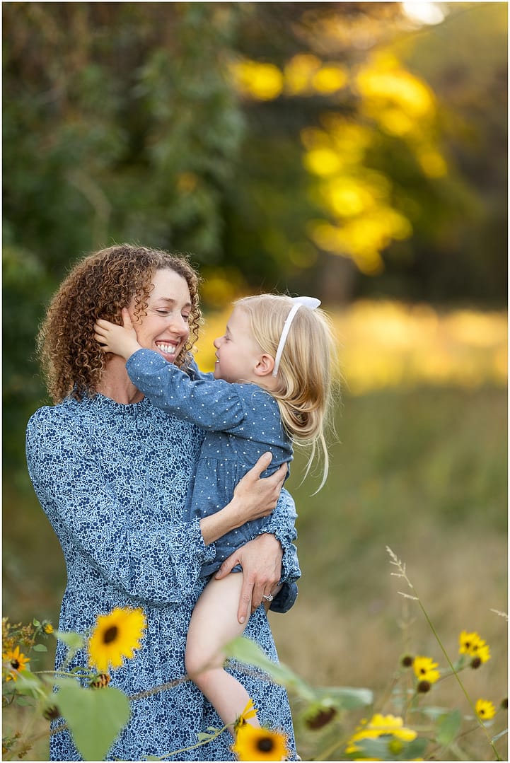 Little girl tickles her mom during Boise family photos. Photo by Tiffany Hix Photography.