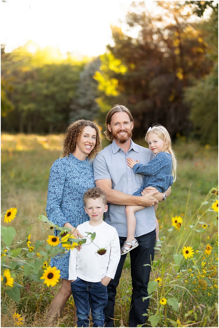 Family of four is photographed among sunflowers in Boise. Photo by Tiffany Hix Photography.