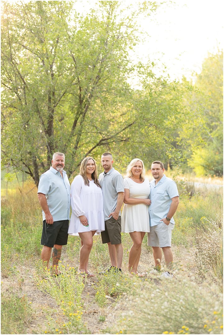 Boise family portraits in green field. Photo by Tiffany Hix Photography.