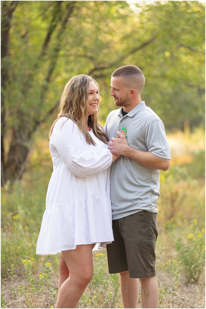 Expecting parents to be embrace. Photo by Tiffany Hix Photography.