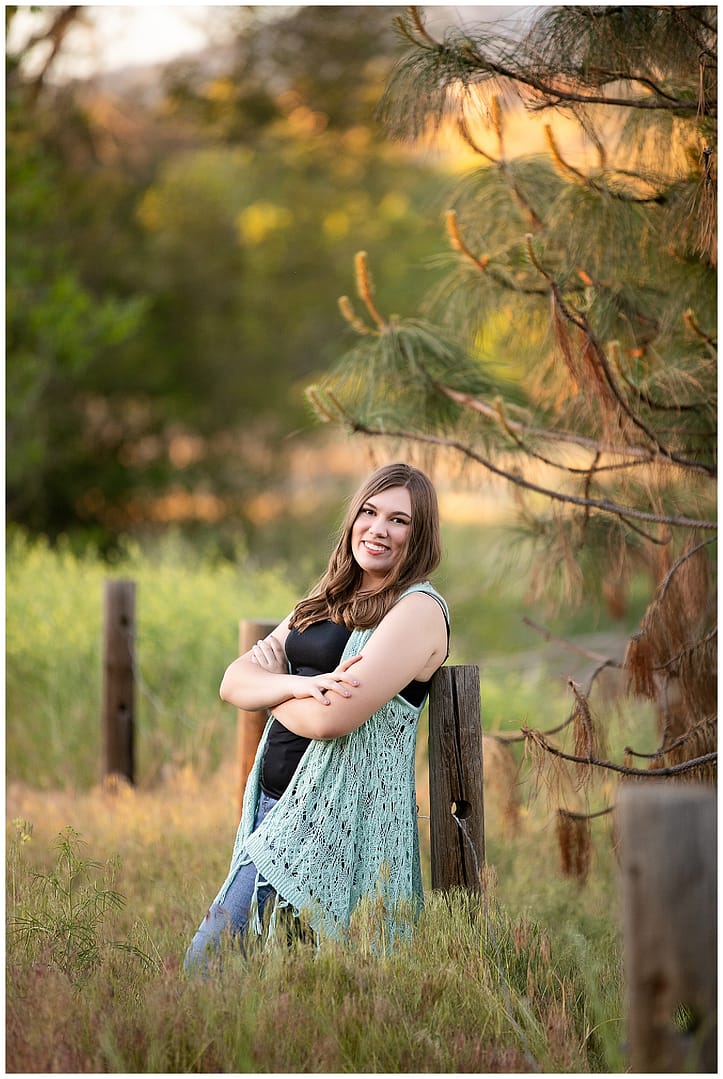 Girl stands in field for Boise Senior Session. Photos by Tiffany Hix.