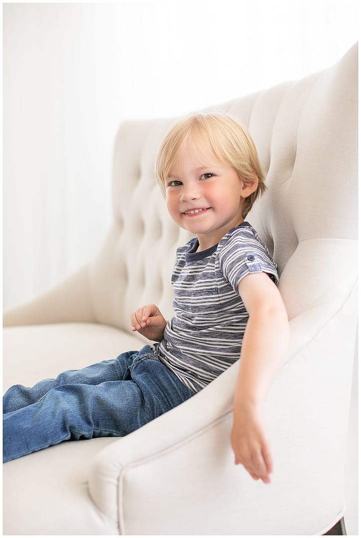 Young boy poses for portrait in studio. Photos by Tiffany Hix Photography.