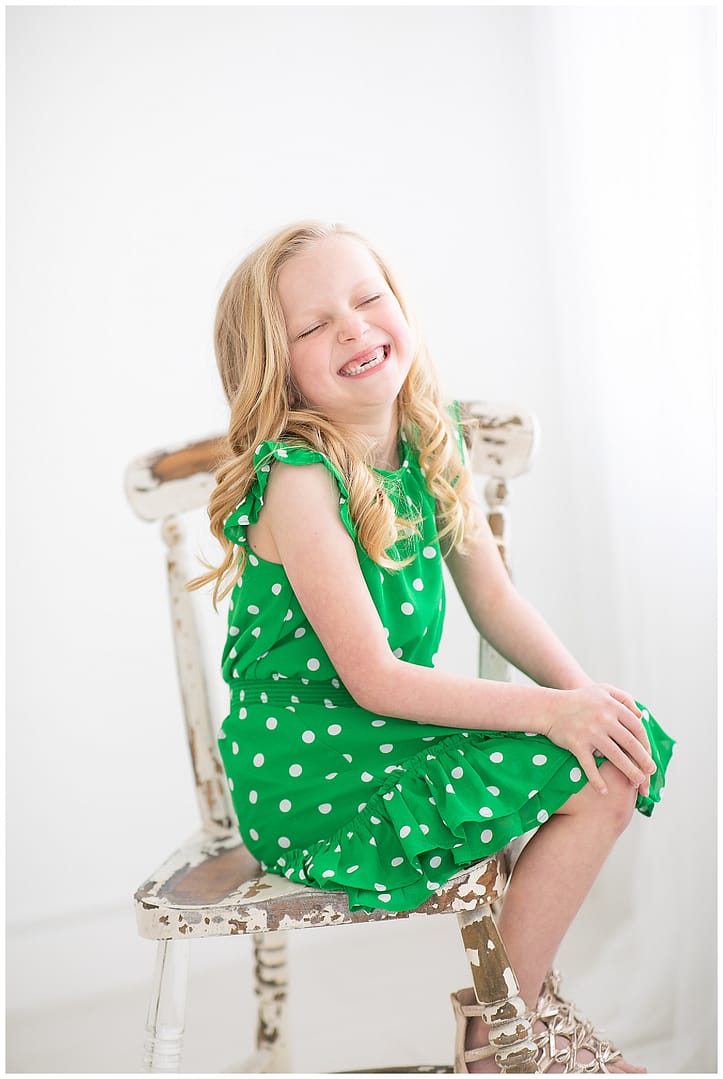 Child laughs during portrait. Photos by Tiffany Hix Photography.