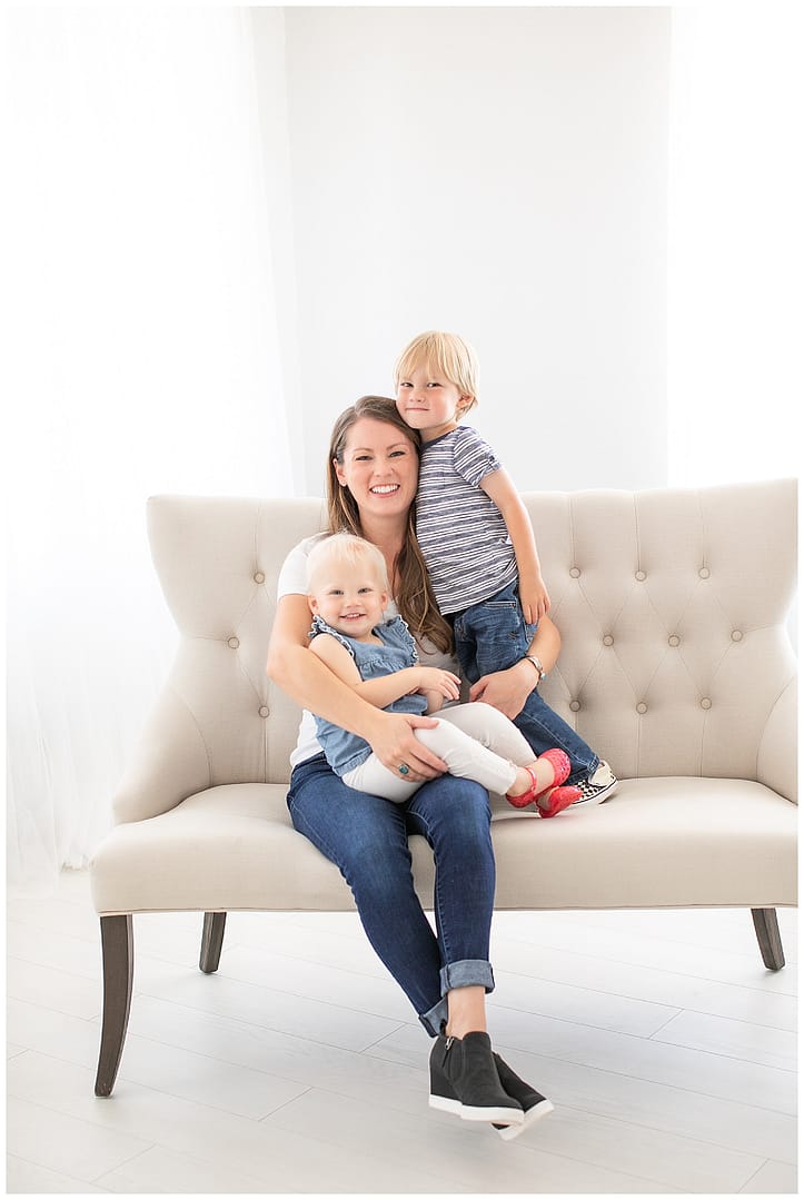 Mom poses with her children in studio. Photos by Tiffany Hix Photography.
