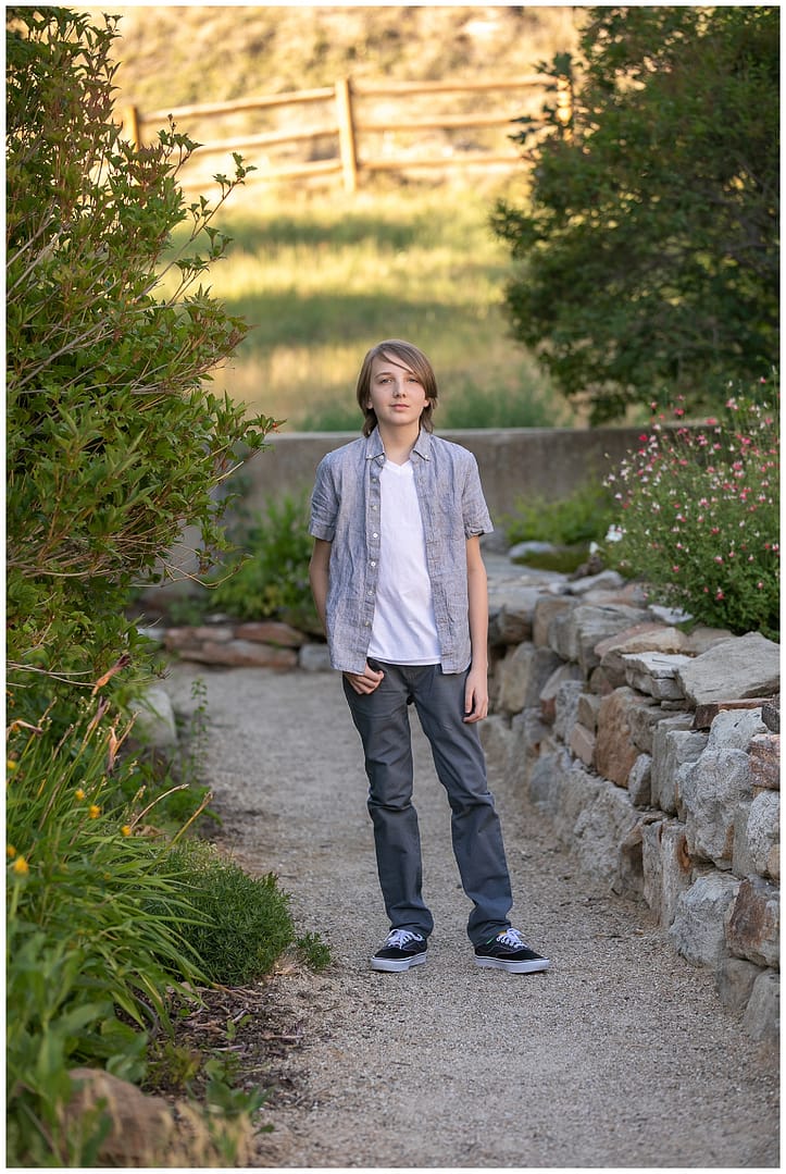 Boy stands for portrait. Photo by Tiffany Hix.