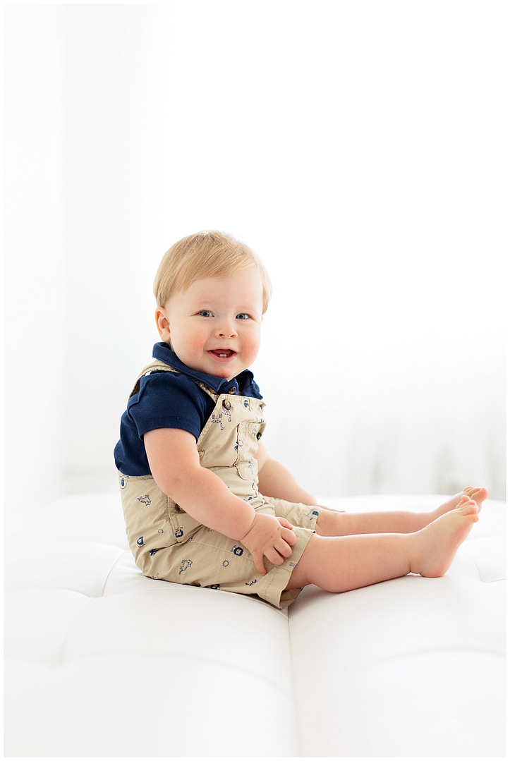 Baby boy is all smiles during milestone session. Photo by Tiffany Hix Photography.