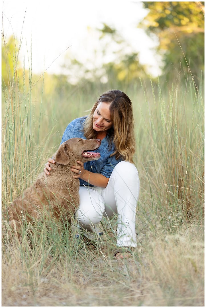Mom takes portrait with her brown dog. Photo by Tiffany Hix Photography.
