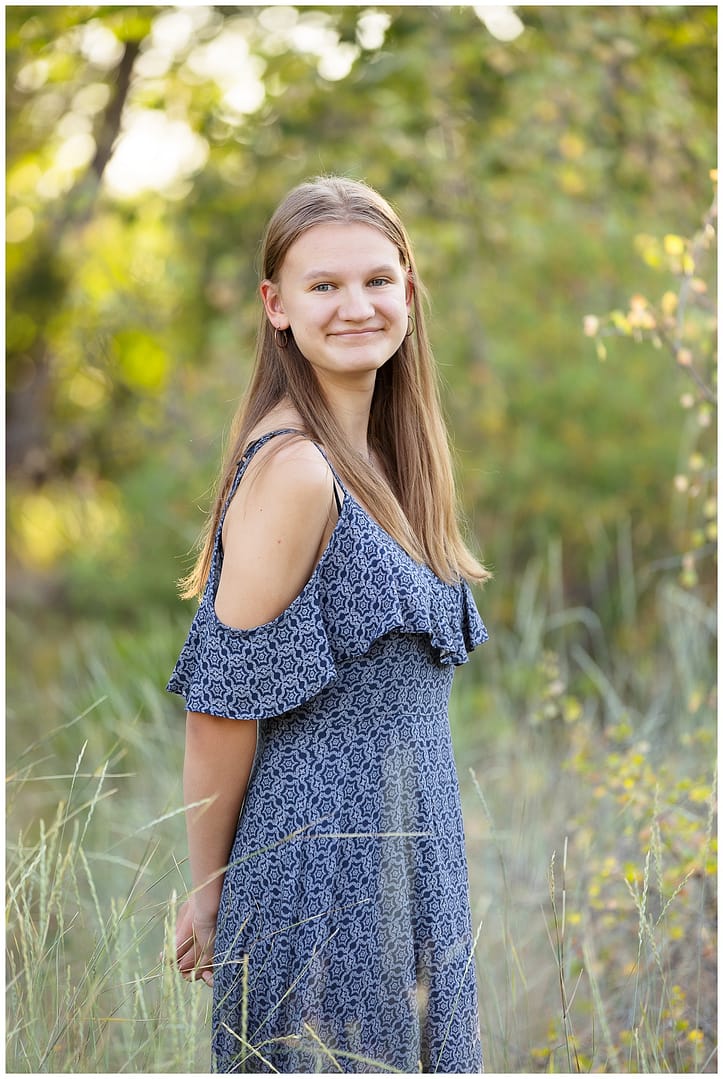 Teen girl poses for portrait during Boise family photo session. Photo by Tiffany Hix Photography.