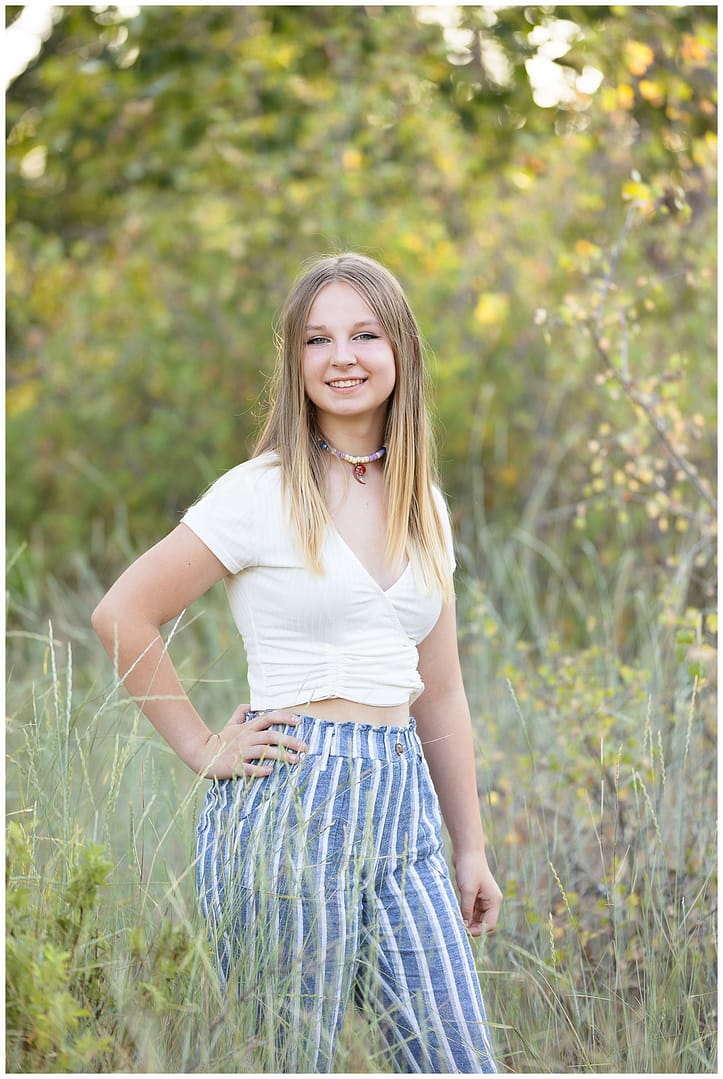 Young blonde teen poses for her portrait. Photo by Tiffany Hix Photography.