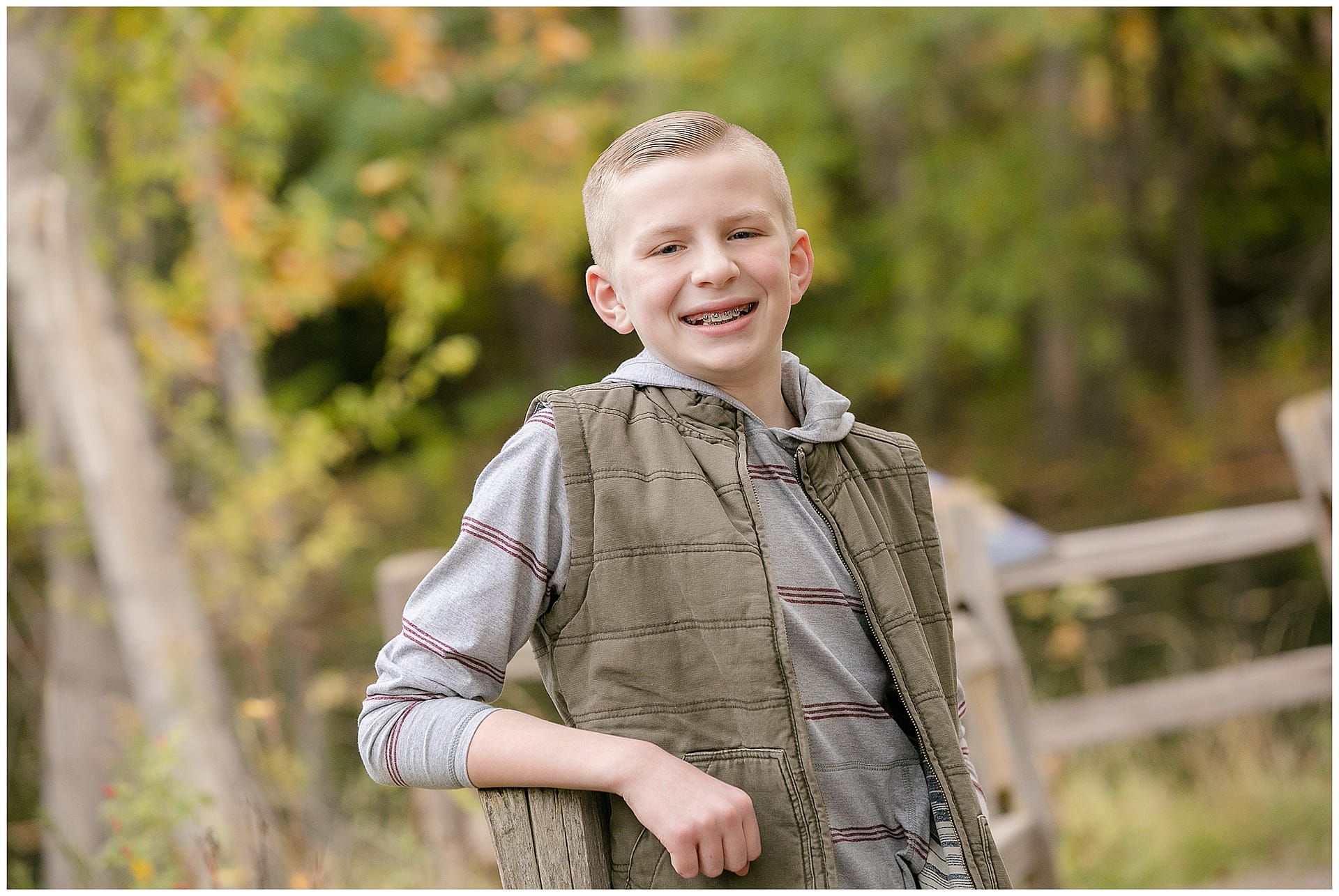 Young boy poses for portrait. Photo by Tiffany Hix Photography.