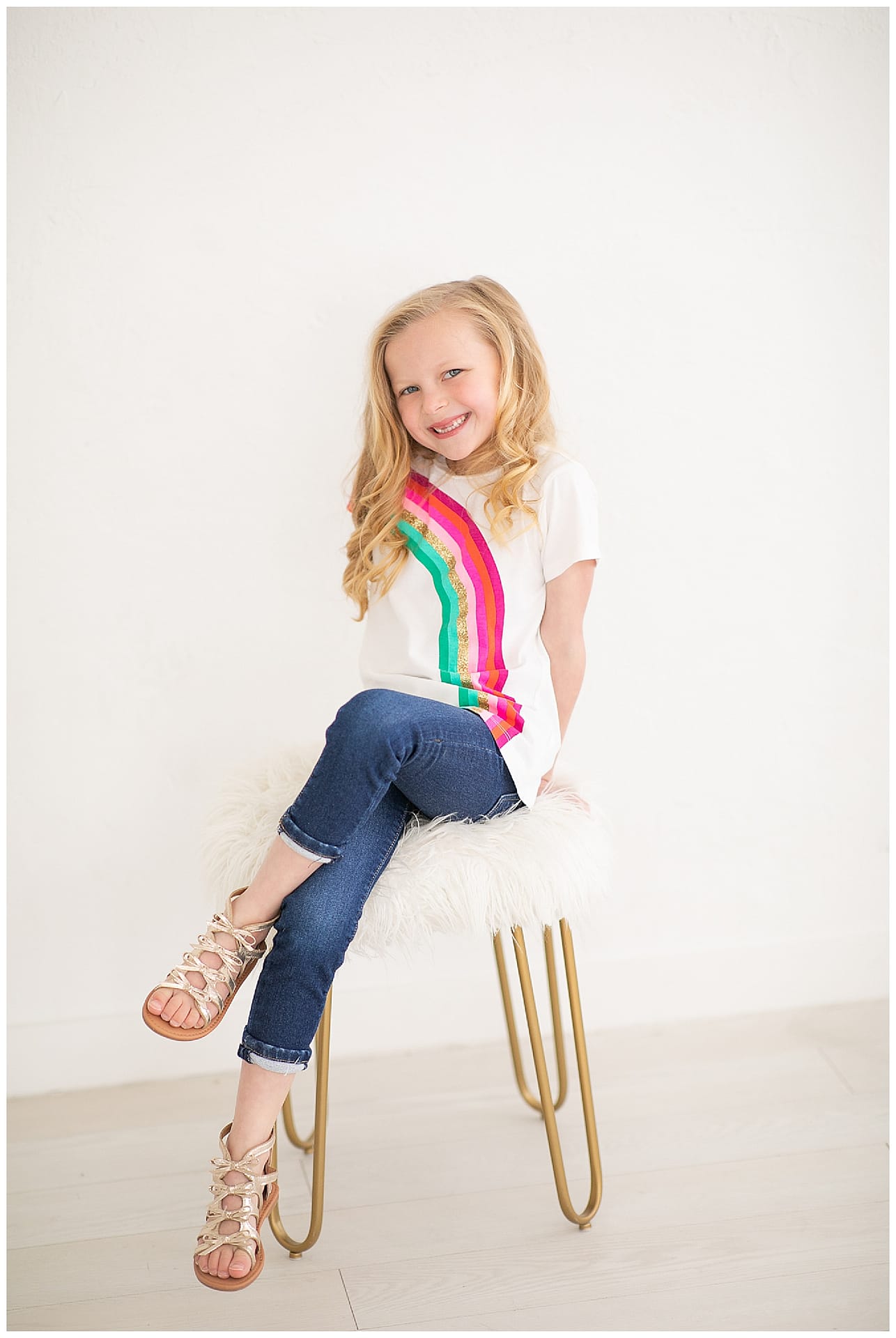 Child sits on stool for photo. Photos by Tiffany Hix Photography.