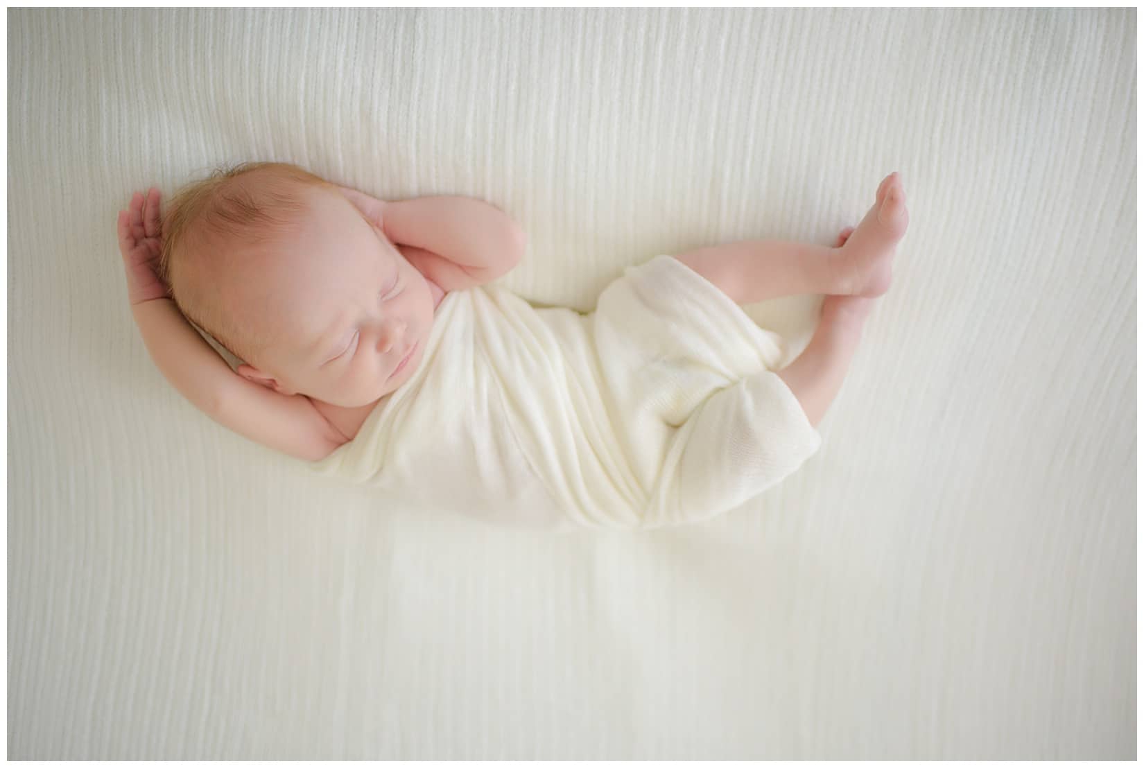 Baby led newborn poses for photograph. Photos by Tiffany Hix Photography.