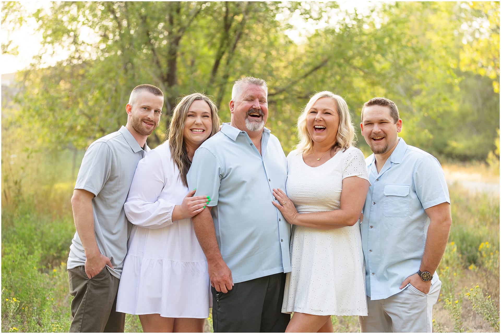 Family of five smiles during pregnancy announcement. Photo by Tiffany Hix Photography.