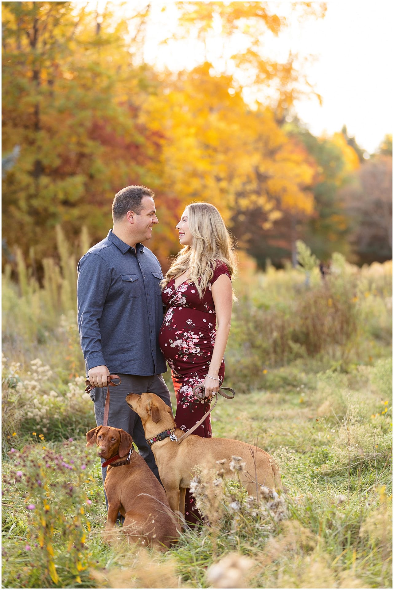 Couple looks at one another lovingly during fall maternity session. Photo by Tiffany Hix Photography.